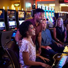 Caishen Wins slot game interface with Chinese symbols and payout table